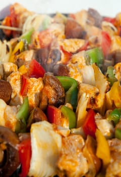 Bar-B-Q or BBQ with kebab cooking. coal grill of chicken meat skewers with mushroom and peppers. barbecuing dinner