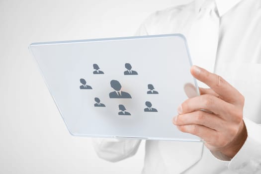 Human resources, personal audit, CRM, and assessment center concept - recruiter select employee (or team leader) represented by icon on futuristic tablet.
