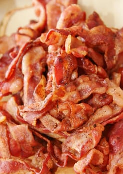 Closeup of slices of crispy grilled bacon strips