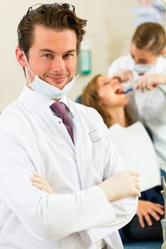 Dentist in his practice