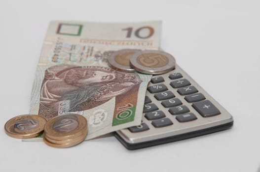 calculator and polish currency on whie background