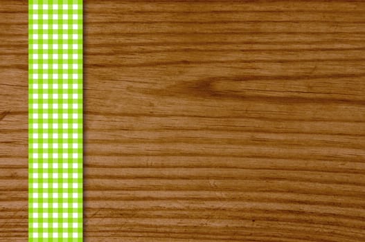 Wooden board with green and white blanket strip