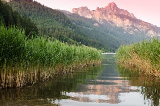 Mountain in Tyrol Austria with reflection in the lake
