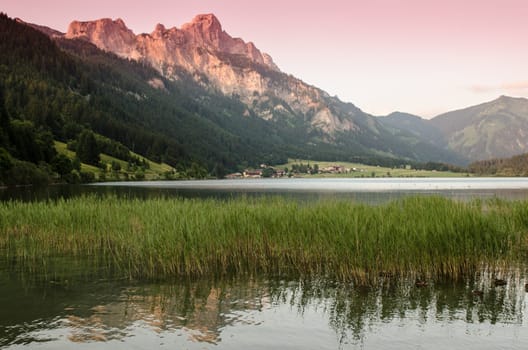 Lake and mountains in Tyrol at sunset