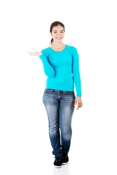 happy,excited young woman presenting copy space on her palm,isolated on white