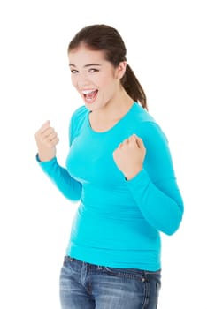 Excited happy success young woman with fists up,isolated on white