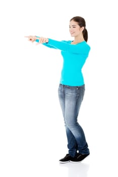 happy,excited young woman pointing a copy space,isolated on white