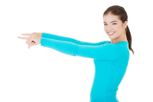 happy,excited young woman pointing a copy space,isolated on white