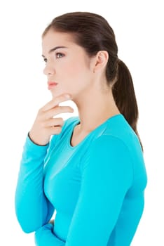 beautiful teenage girl is thinking. isolated on white background