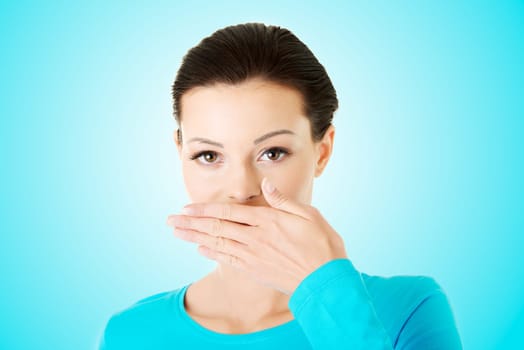 Woman covering mouth with hand