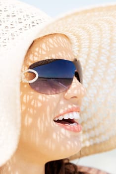 beautiful woman on a beach. coastline in sunglasses.