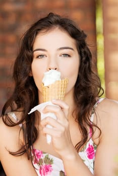 portrait of young happy woman eating ice-cream,outdoor