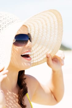 beautiful woman on a beach. coastline in sunglasses.