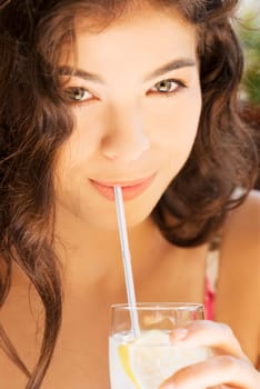 beautiful girl with drink or water in cafe
