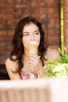 portrait of young happy woman eating ice-cream,outdoor