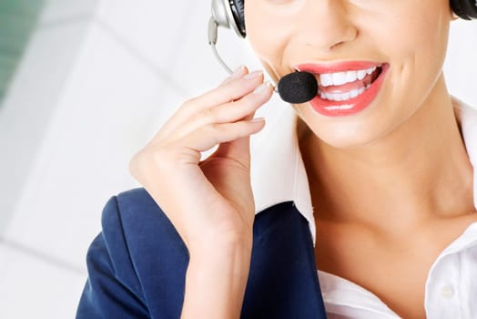 pretty call-center assistant smiling at the camera
