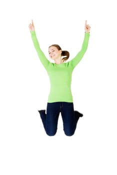Young happy caucasian woman jumping in the air ,isolated on white background