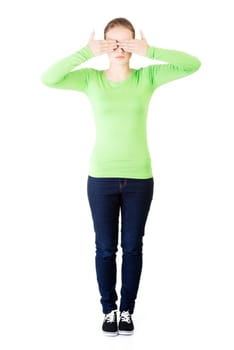 young teen woman covering her face,isolated on white