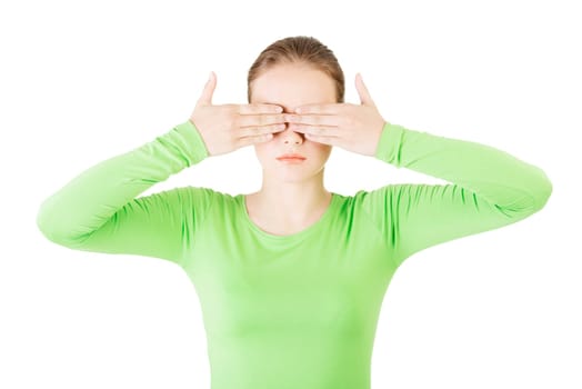 young teen woman covering her face with hands,isolated on white