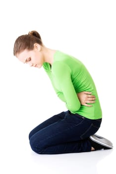 young woman with stomach issues,isolated on white