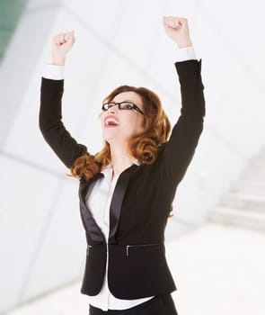 success,winner businesswoman with fists up