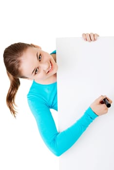 happy beautiful woman writing with a pen on blank board. student or businesswoman.