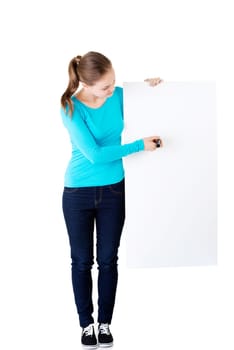 happy beautiful woman writing with a pen on blank board. student or businesswoman.