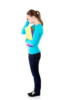 young beautiful student woman with depression or a problem isolated on white