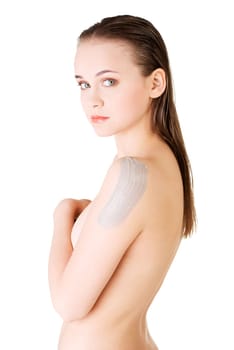 beautiful face of spa woman with healthy clean skin and clay mask on arm. isolated on white.