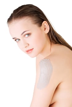 beautiful face of spa woman with healthy clean skin and clay mask on arm. isolated on white.