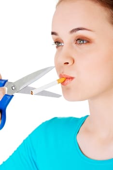Quit tuxedo . Woman cutting cigarette with scissors.