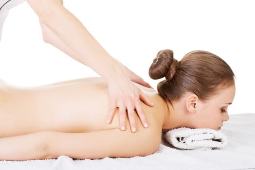 preaty young woman relaxing beeing massaged in spa saloon. isolated on white