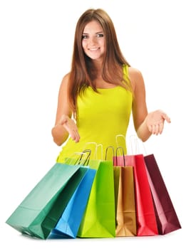 Young happy woman with colorful paper shopping bags isolated on white