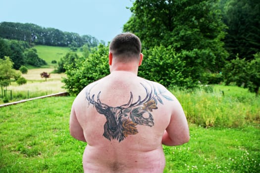 Man with tattoo on his back