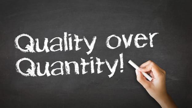 A person drawing and pointing at a Quality over Quantity Chalk Illustration