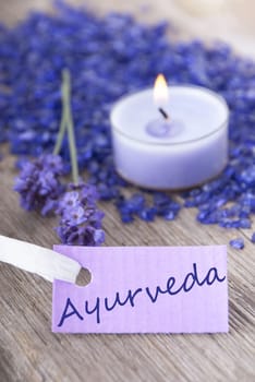 the word Ayurveda on a purple label as wellness background