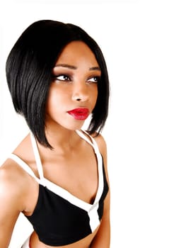A portrait picture of a young woman with short black hair in an exercise.bra for white background..