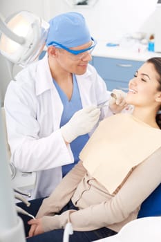 Young girl during oral checkup at the dentist’s