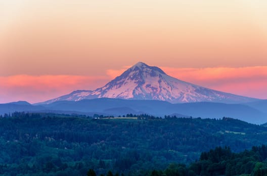 Mount Hood looking purple as the sun sets in the Pacific Northwest