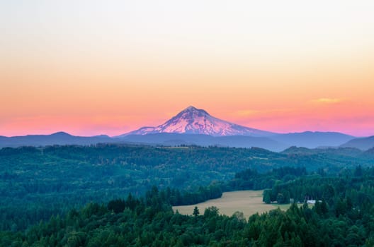 Mount Hood at sunset with a purple glow