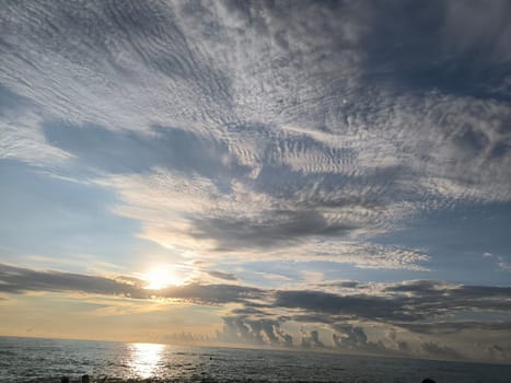 Sea water sunset sky landscape background blue nature orange light wallpaper evening travel white clouds . High quality photo