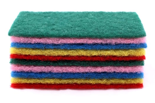 A pile of sponges in different colors.