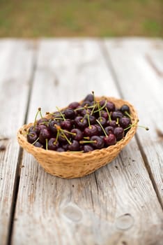 Ripe red cherries in a basket close up