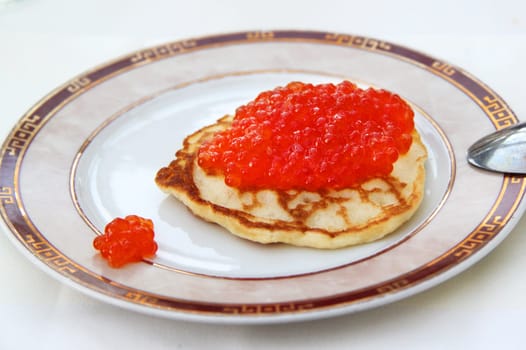 Traditional Russian pancakes  with red caviar