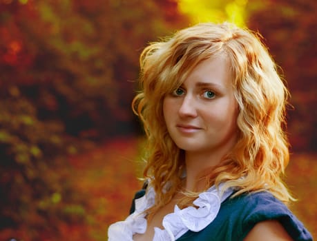 woman standing in a park in autumn
