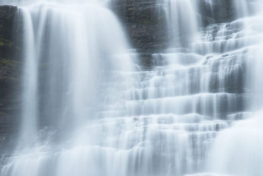 white water cascades running down stones