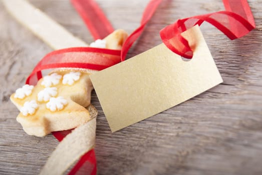 christmas background with golden label with copy space and christmas cookie