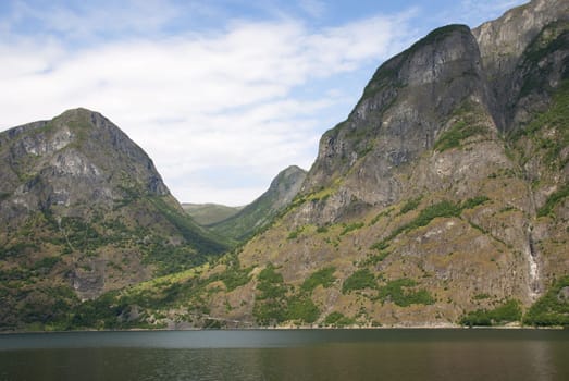 a mountain landscape in a norwegian fjord