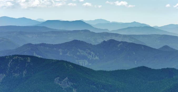 View of the horizon with rows of forested hills