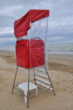 Lifeguard watch tower on the beach on the seaside